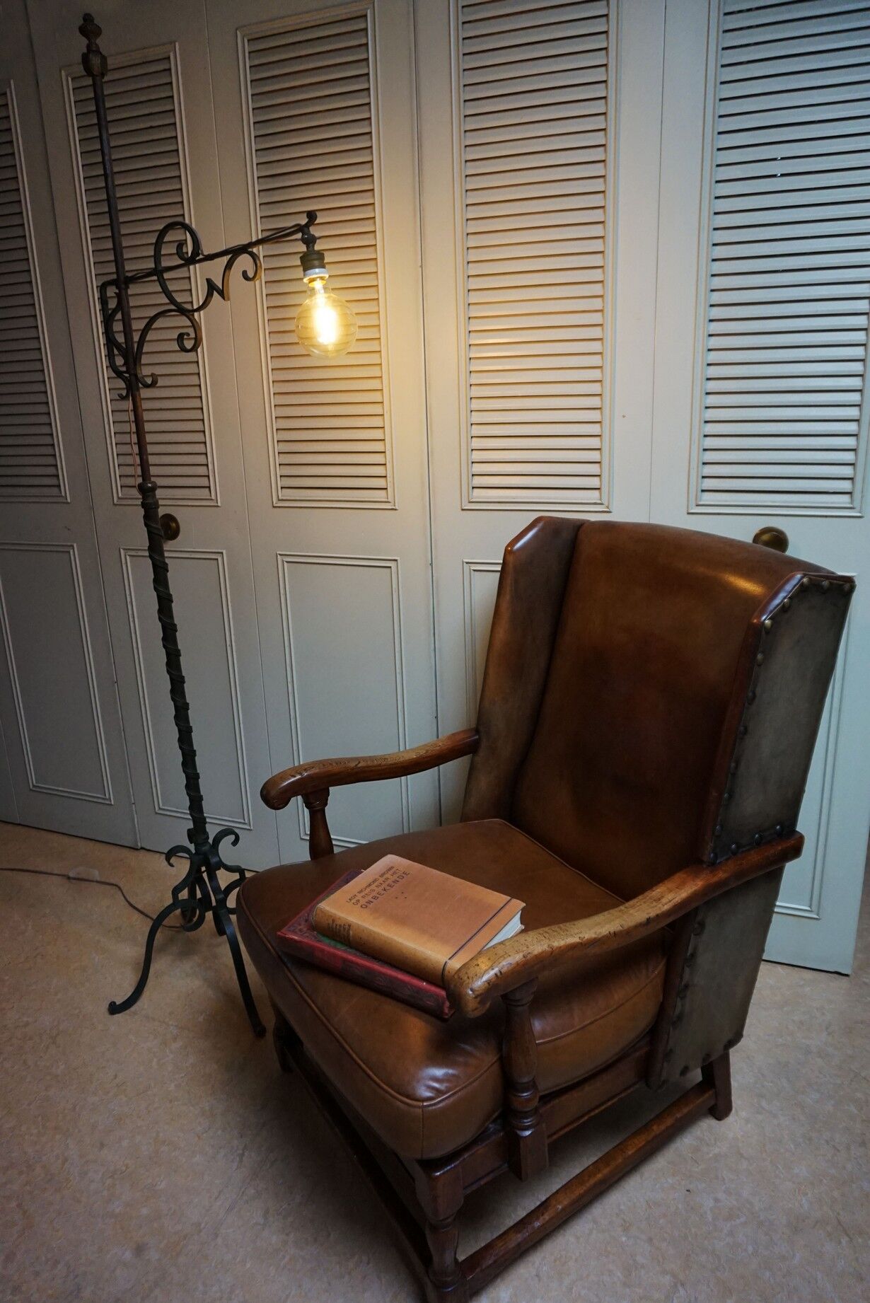 English high back cognac leather wingchair by Criterion cord