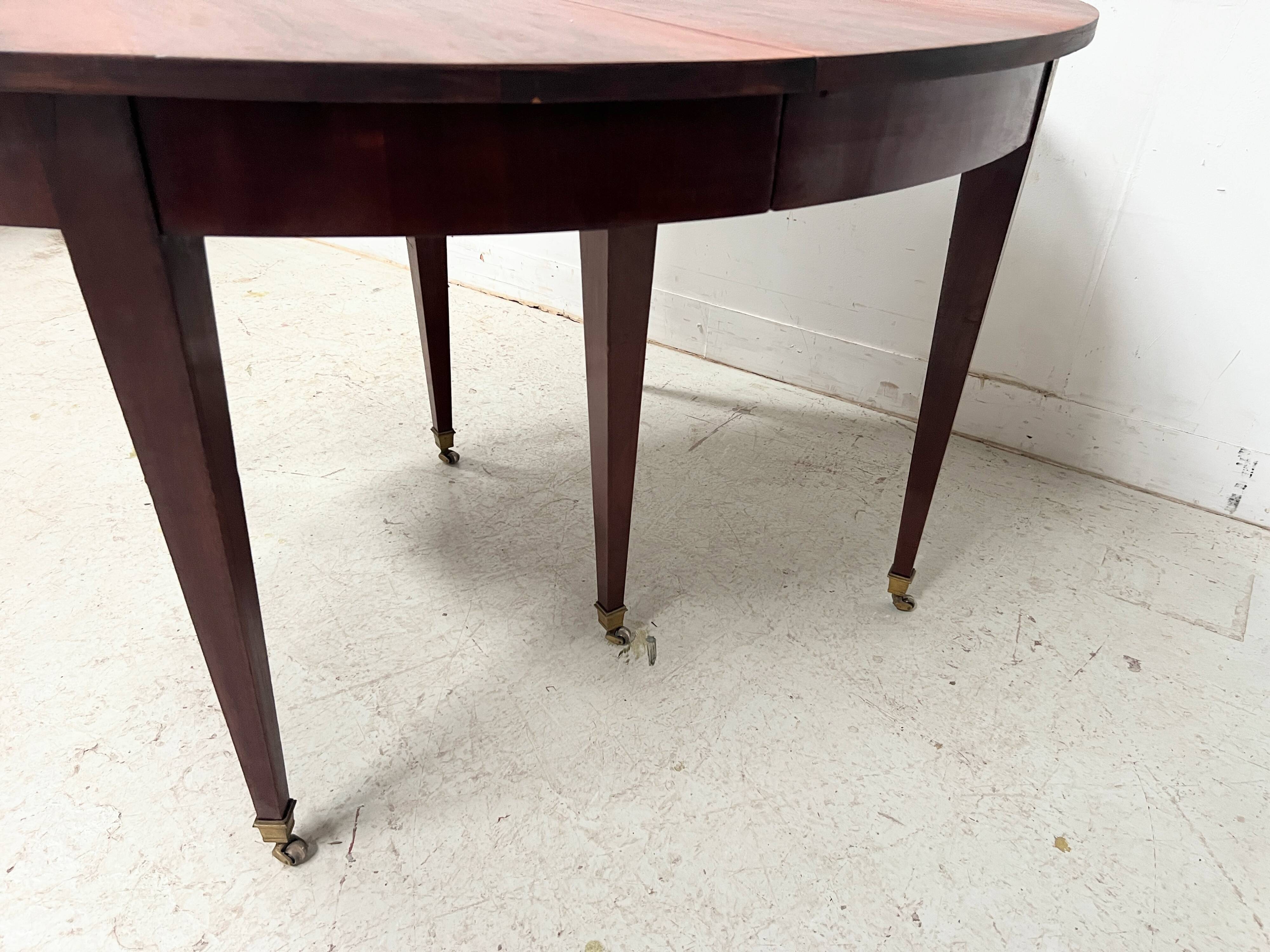 Louis XVI style bandeau table with 6 XIX century tapered legs.