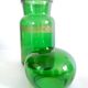 Apothecary jar in vintage green and gold glass