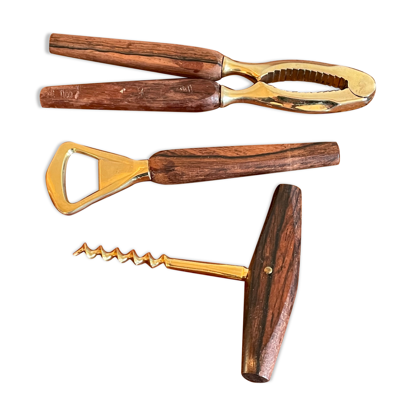 Bottle opener made of teak wood, corkscrew and nutcracker