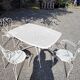 Old wrought iron garden furniture, table + 2 armchairs + 2 chairs