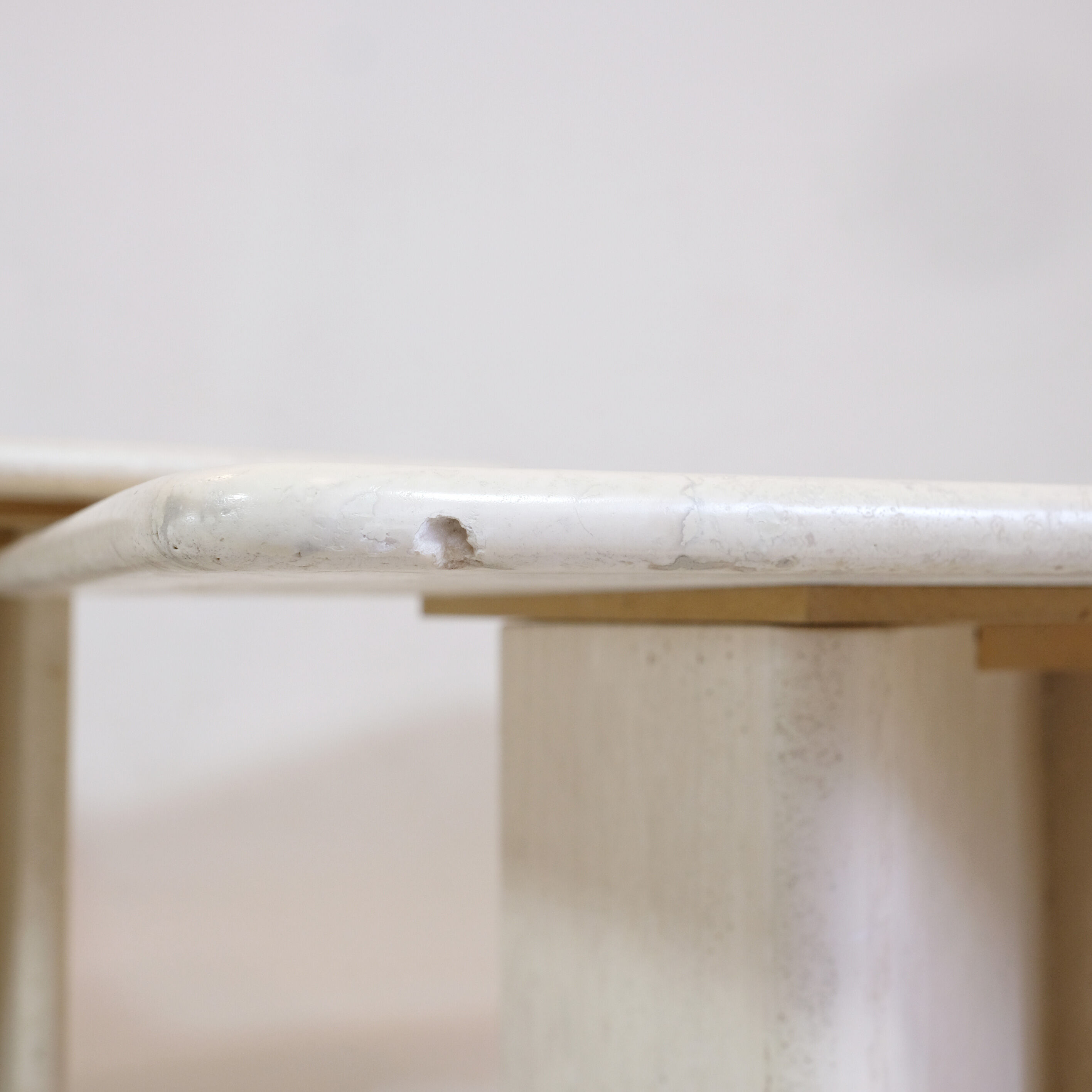 Pair of travertine trundle tables, Italy