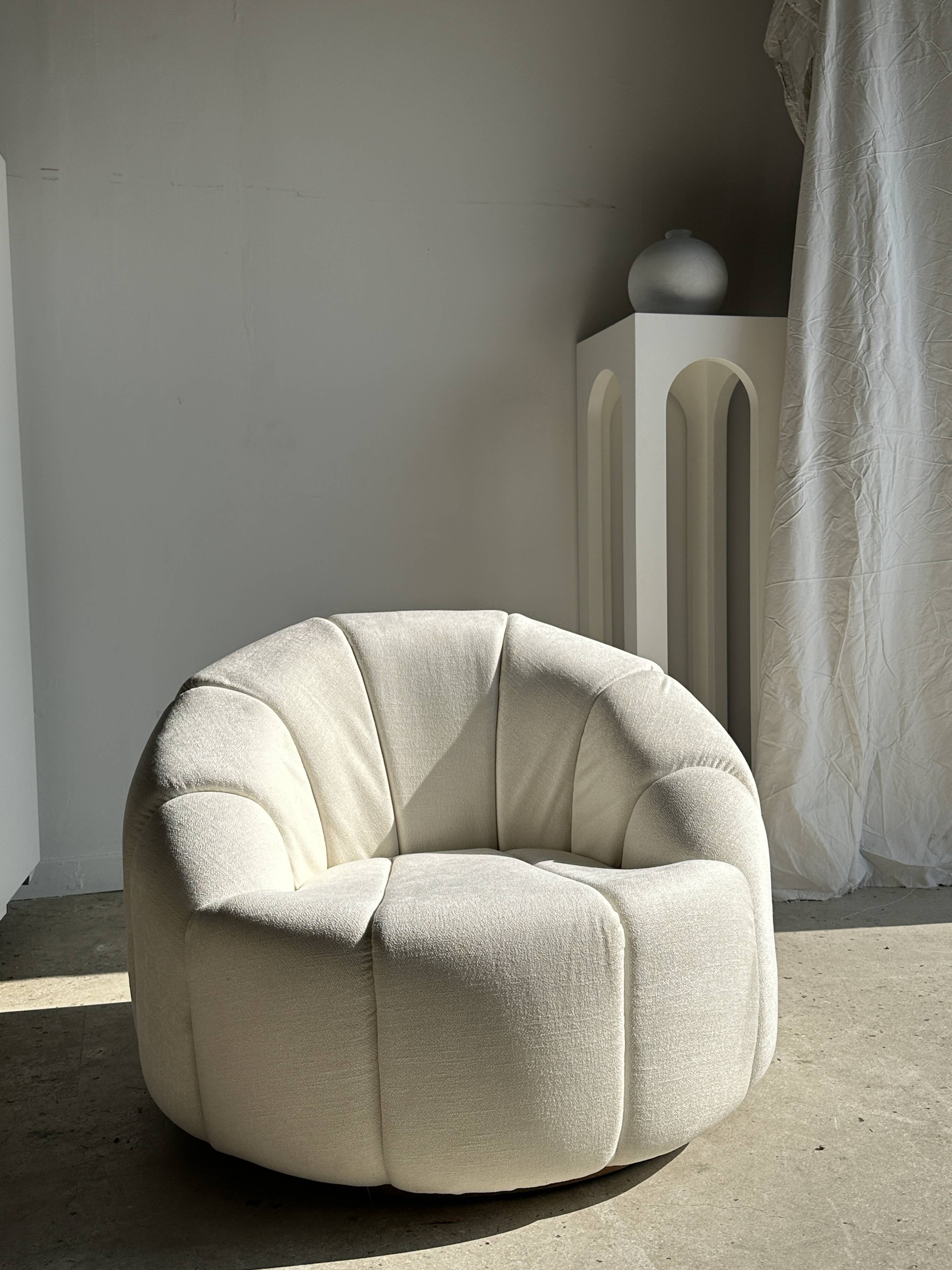 Large white circular armchair, white fabric upholstery