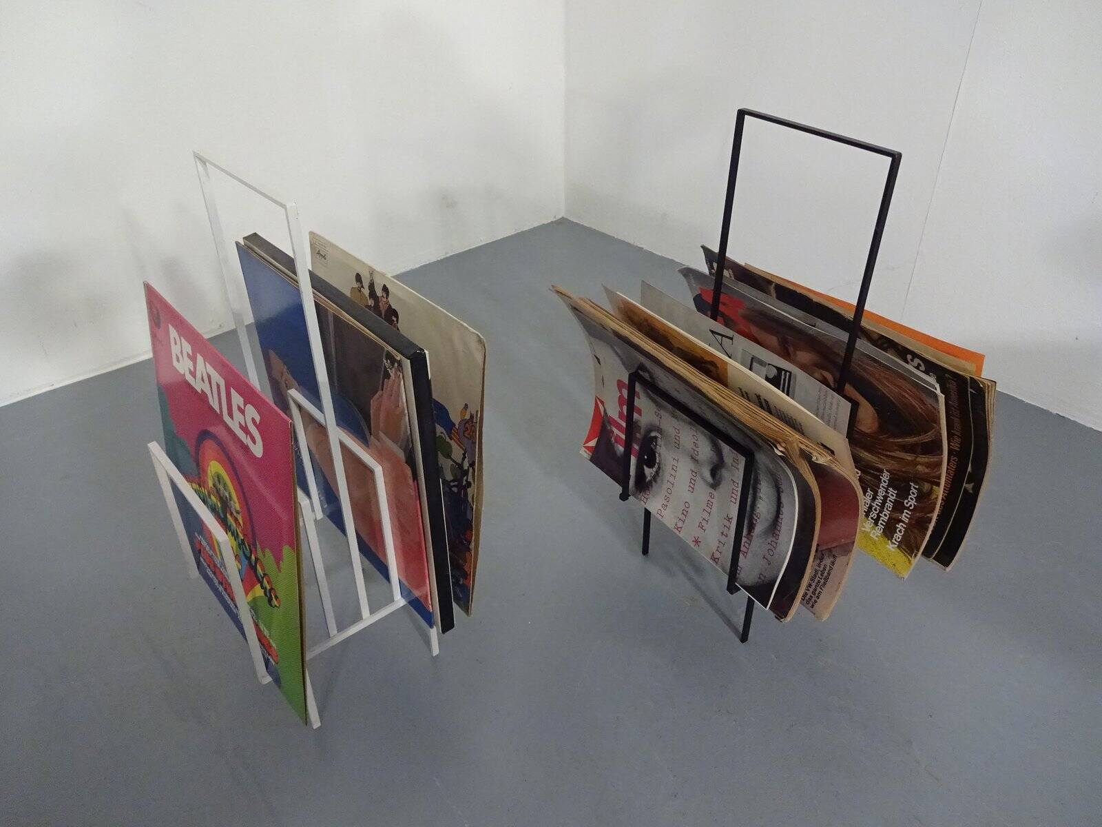 Steel magazine or record racks, 1960s, set of 2