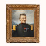 Antique portrait painting of a decorated gentleman with icy blue eyes