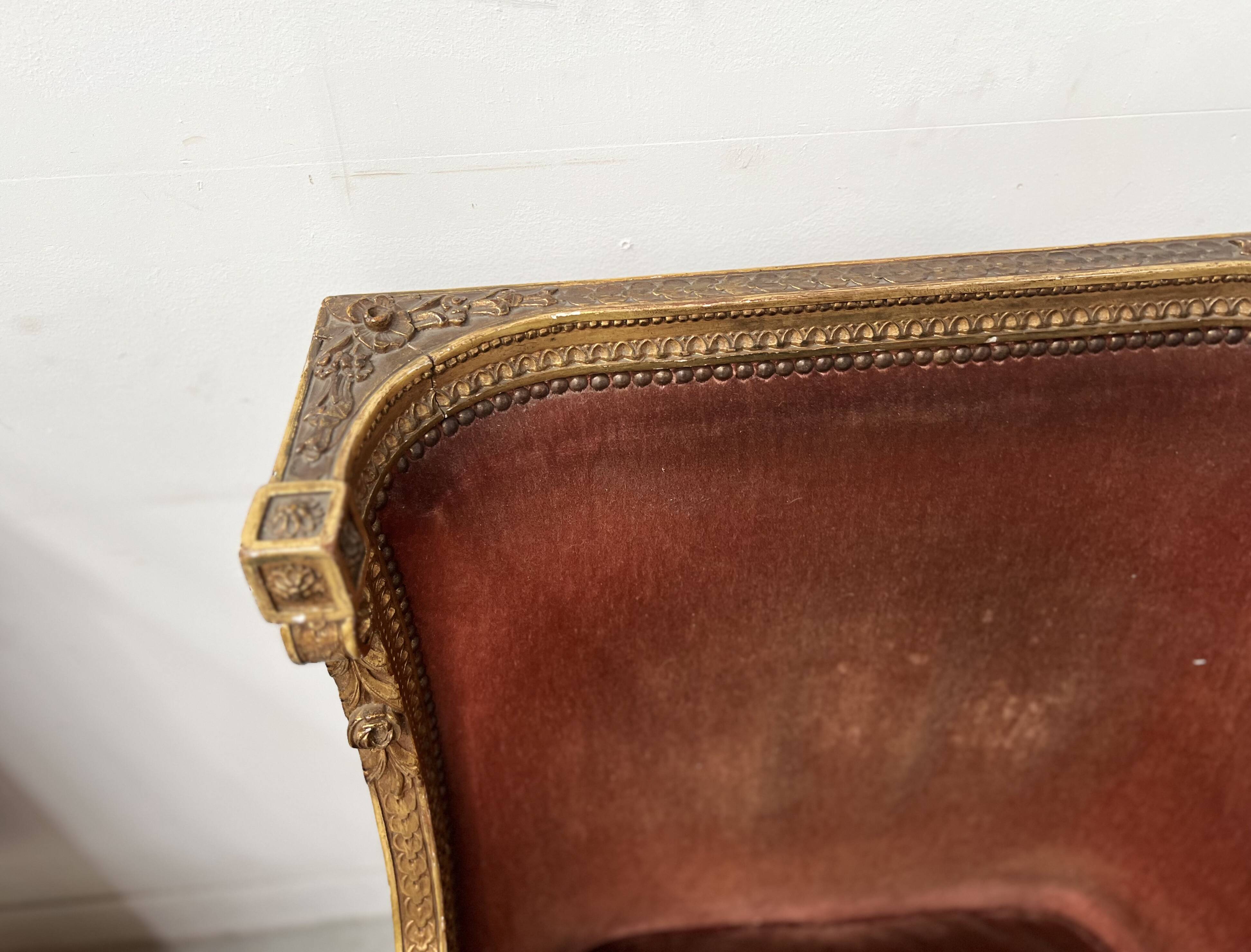 Two Louis XVI style wing chairs in gilded wood, 20th century