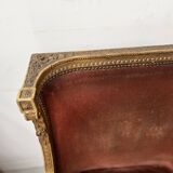 Two Louis XVI style wing chairs in gilded wood, 20th century