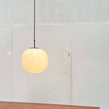 Minimalist suspended glass ball lamp from the vintage German space age by Glashütte Limburg, 1970s.