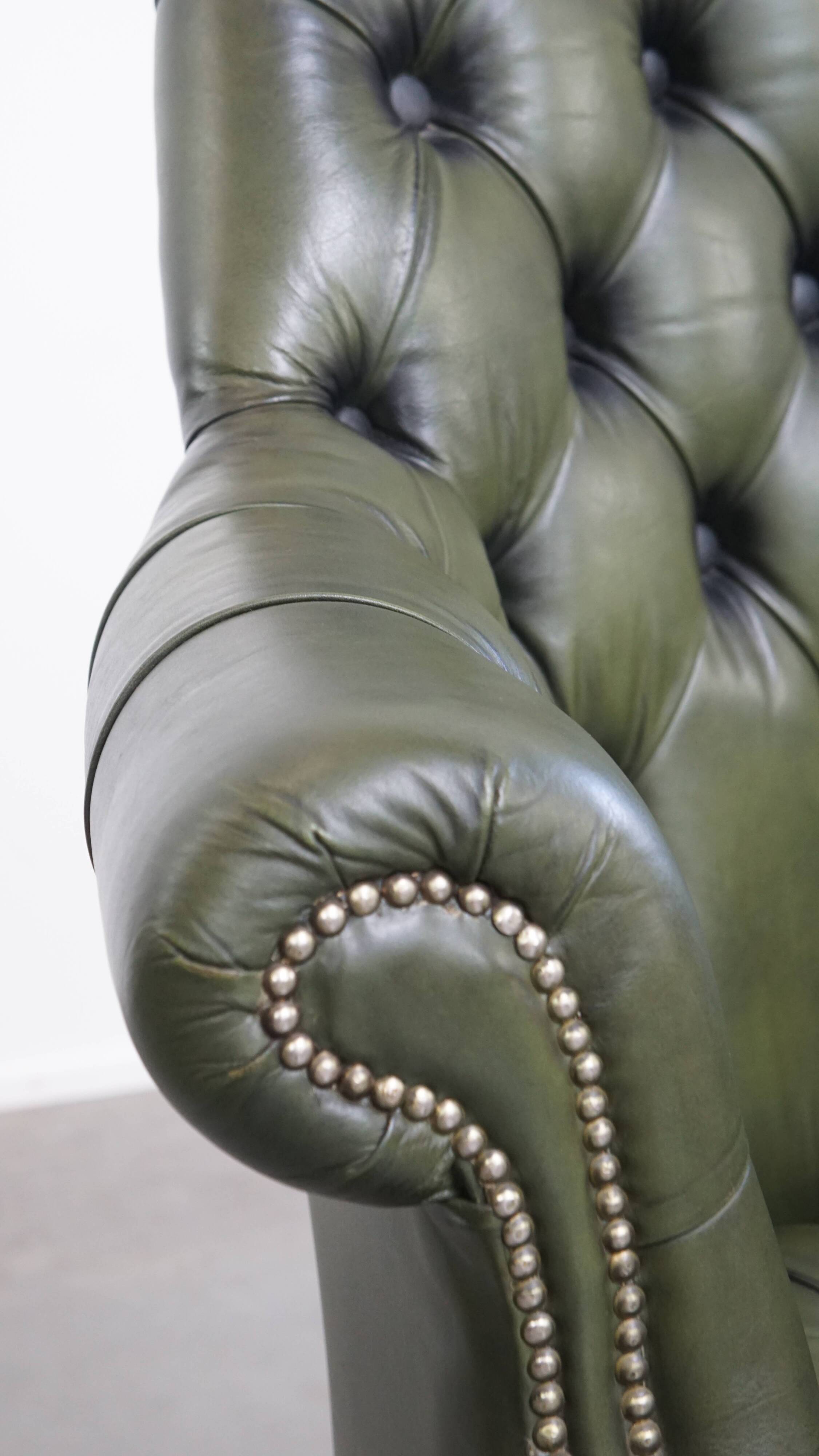 Chesterfield office chair in green cowhide leather on casters with high back