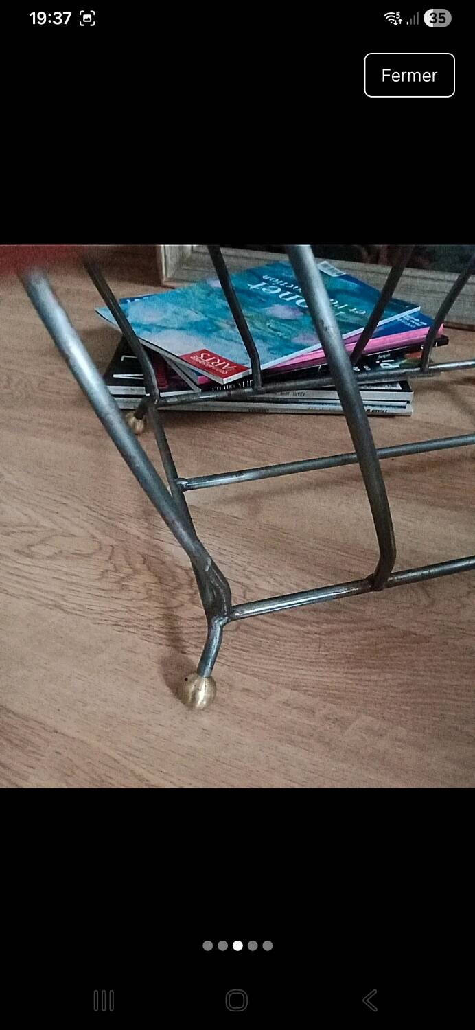 Vintage magazine rack with brass legs