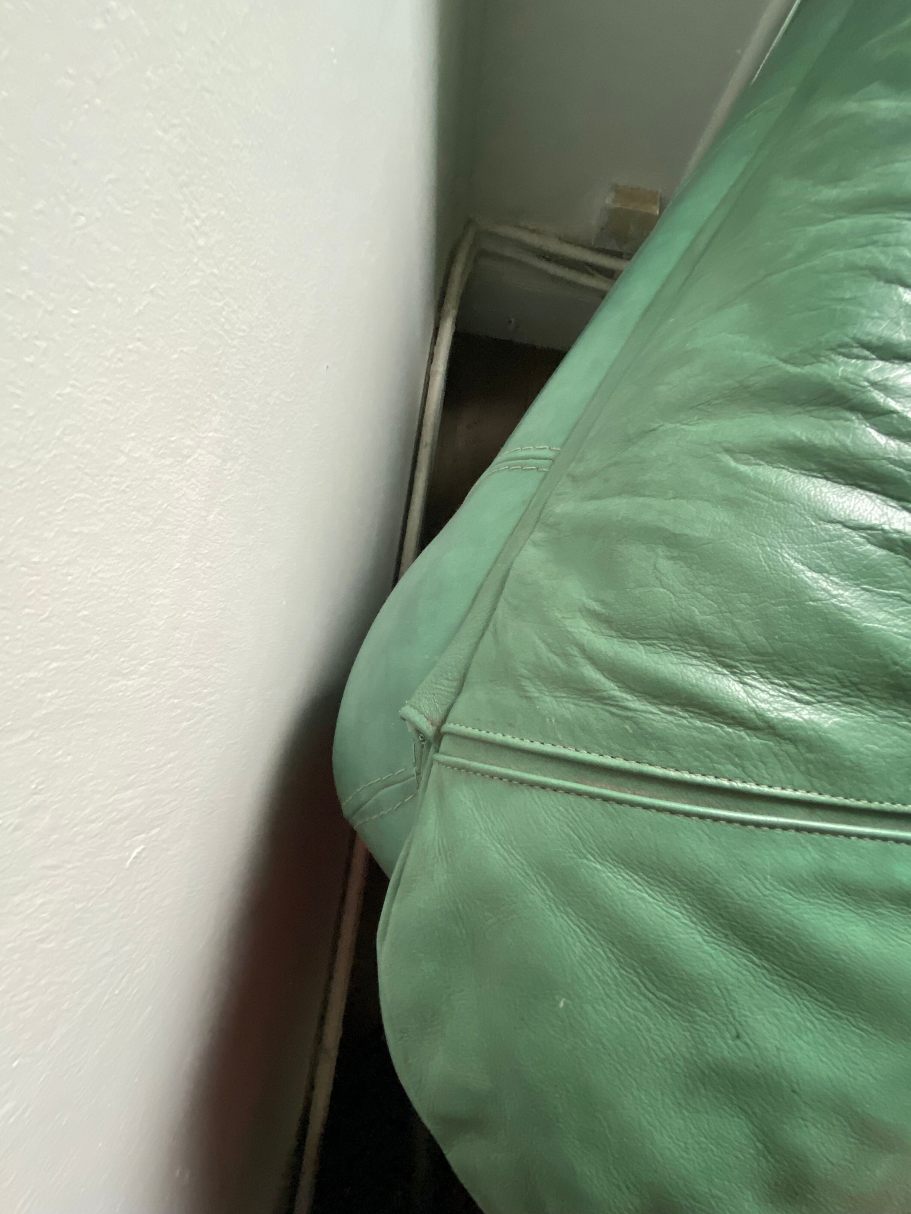 New armchair in vintage green leather