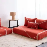 Handmade Moroccan floor cushion in orange cotton.