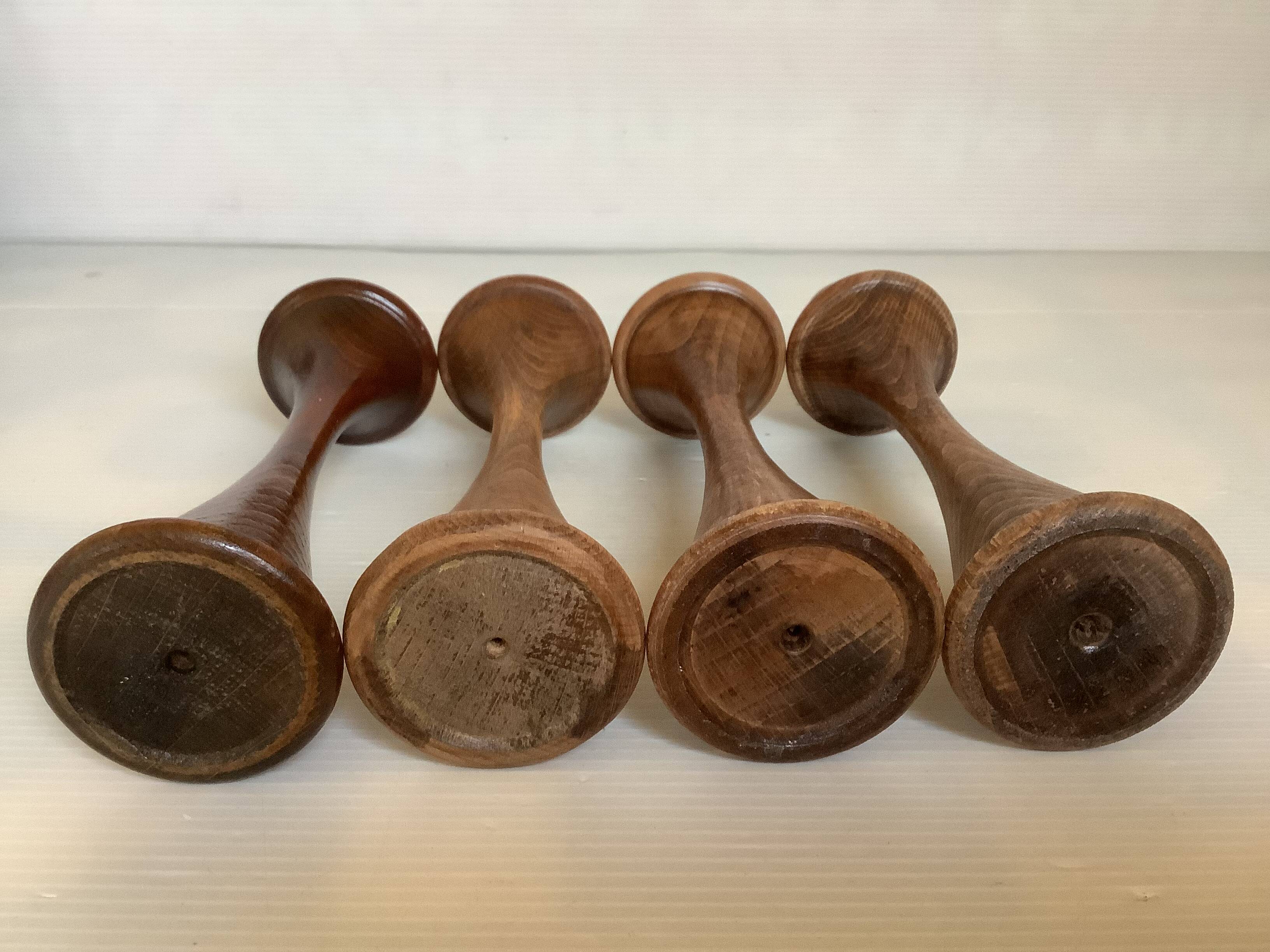 Four Scandinavian-style wooden candle holders