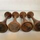 Four Scandinavian-style wooden candle holders