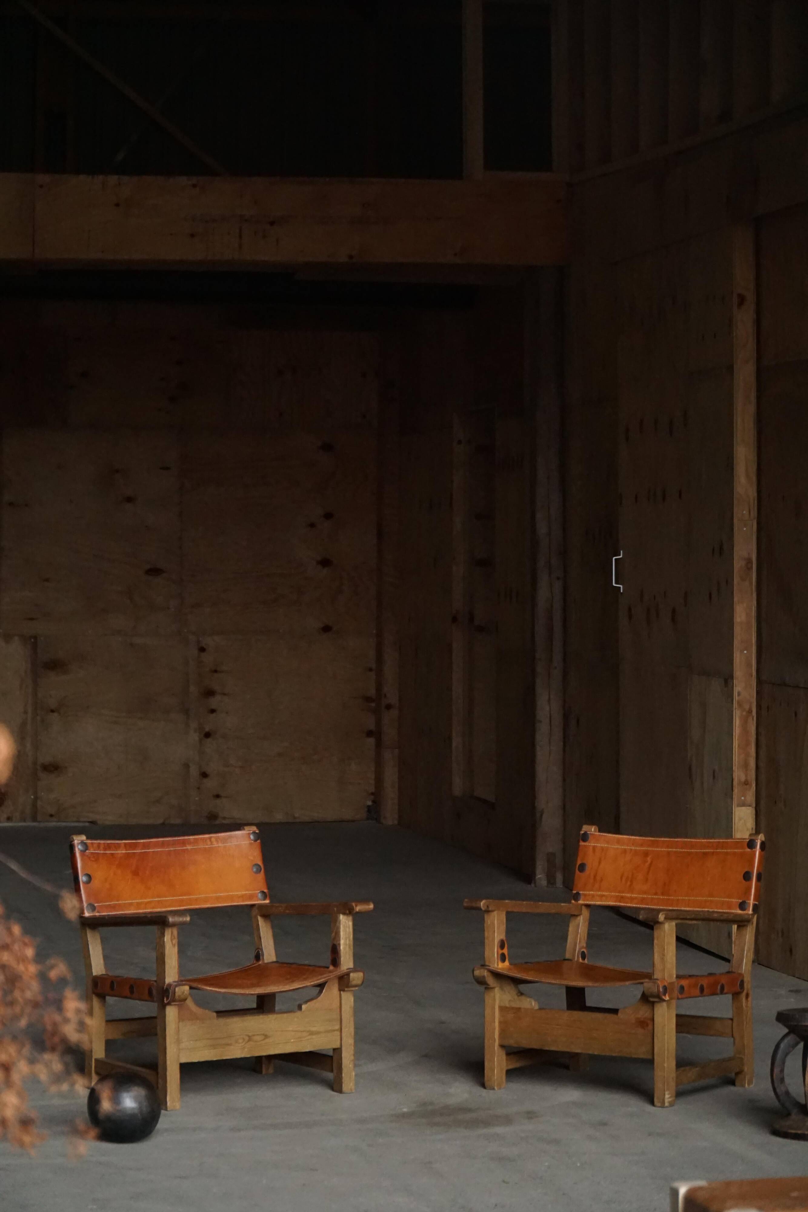 Pair of Spanish brutalist armchairs from the 1960s, wood and leather.