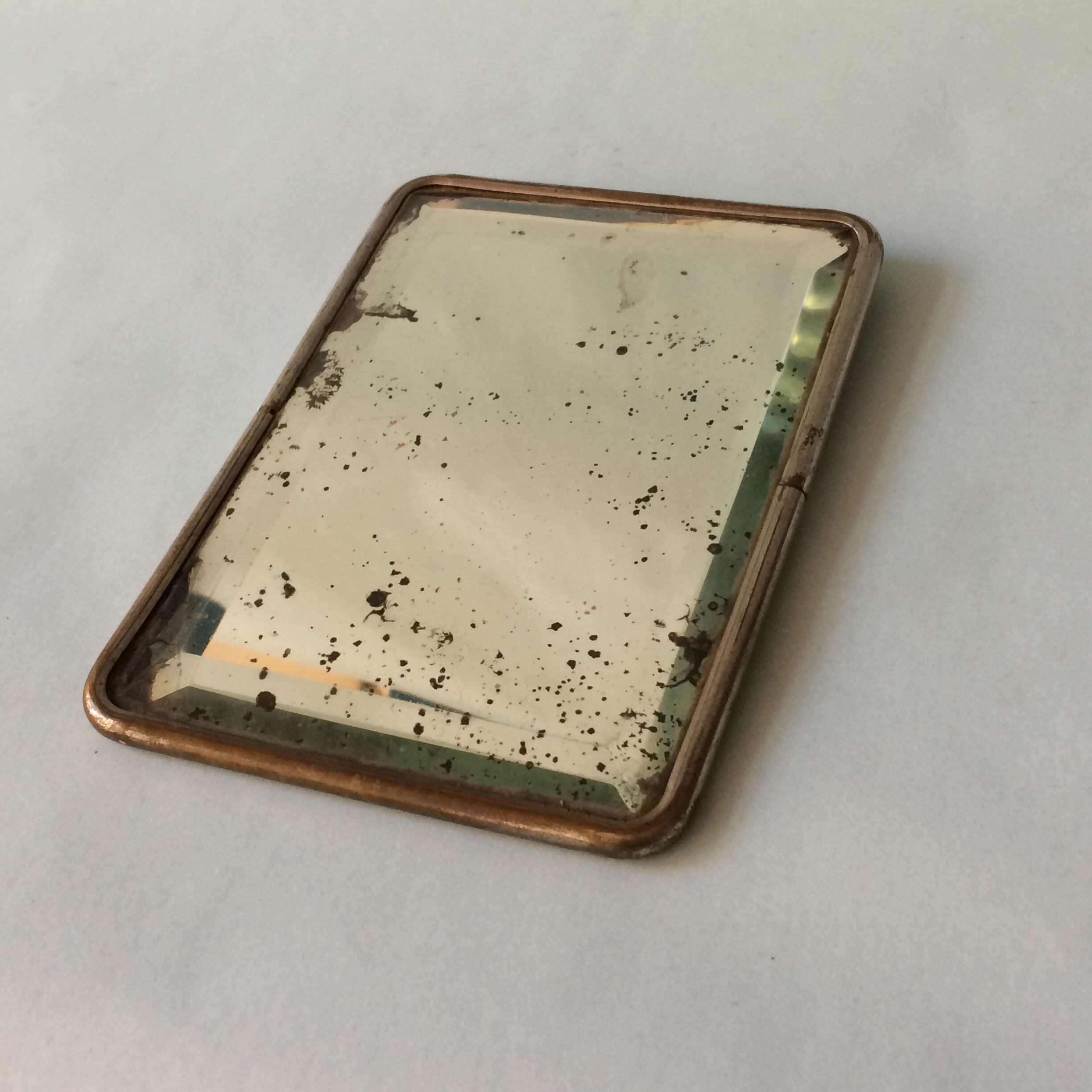 Antique travel mirror with a wide bevel