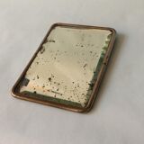 Antique travel mirror with a wide bevel