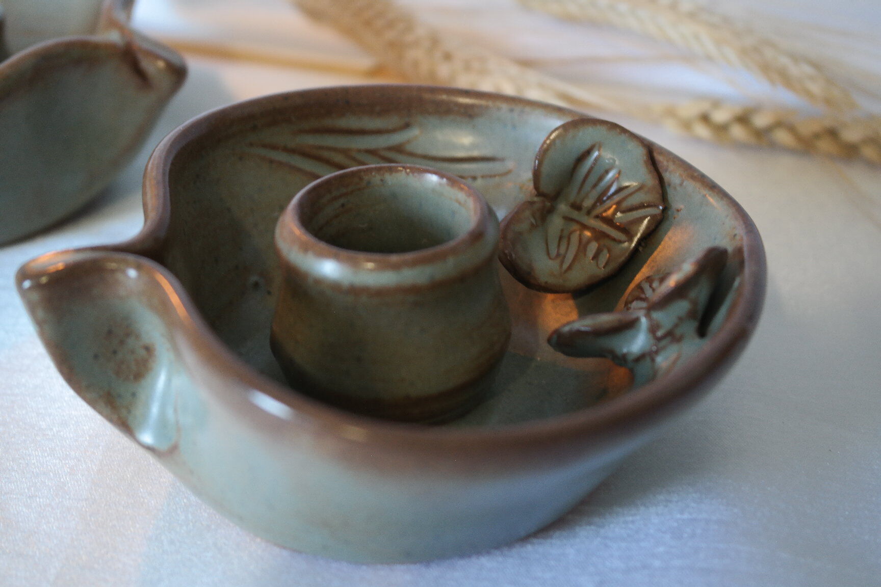 Pair of cellar rat candle holders in glazed sandstone
