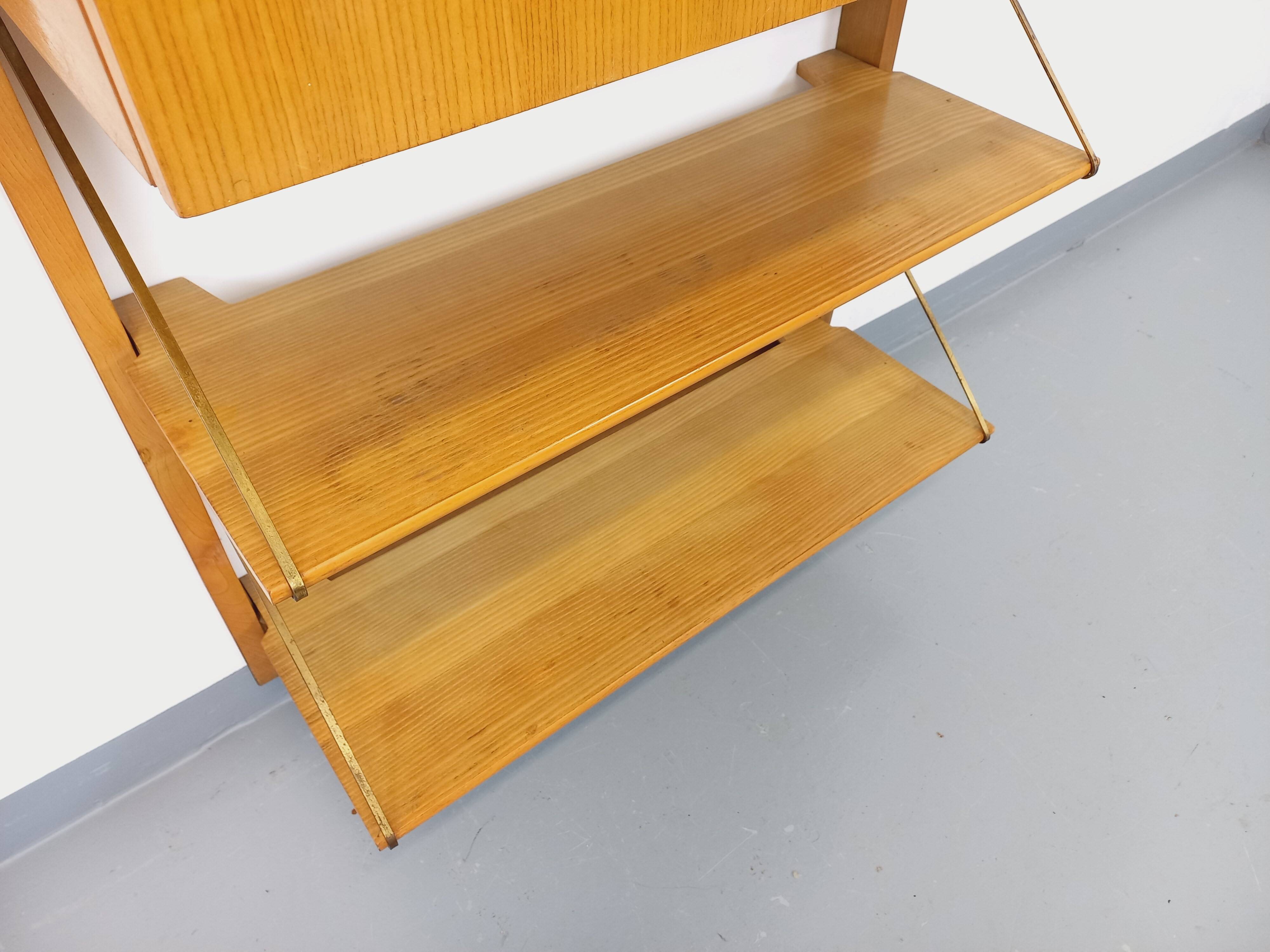 Wall shelf library with vintage light wood secretary bar