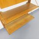 Wall shelf library with vintage light wood secretary bar