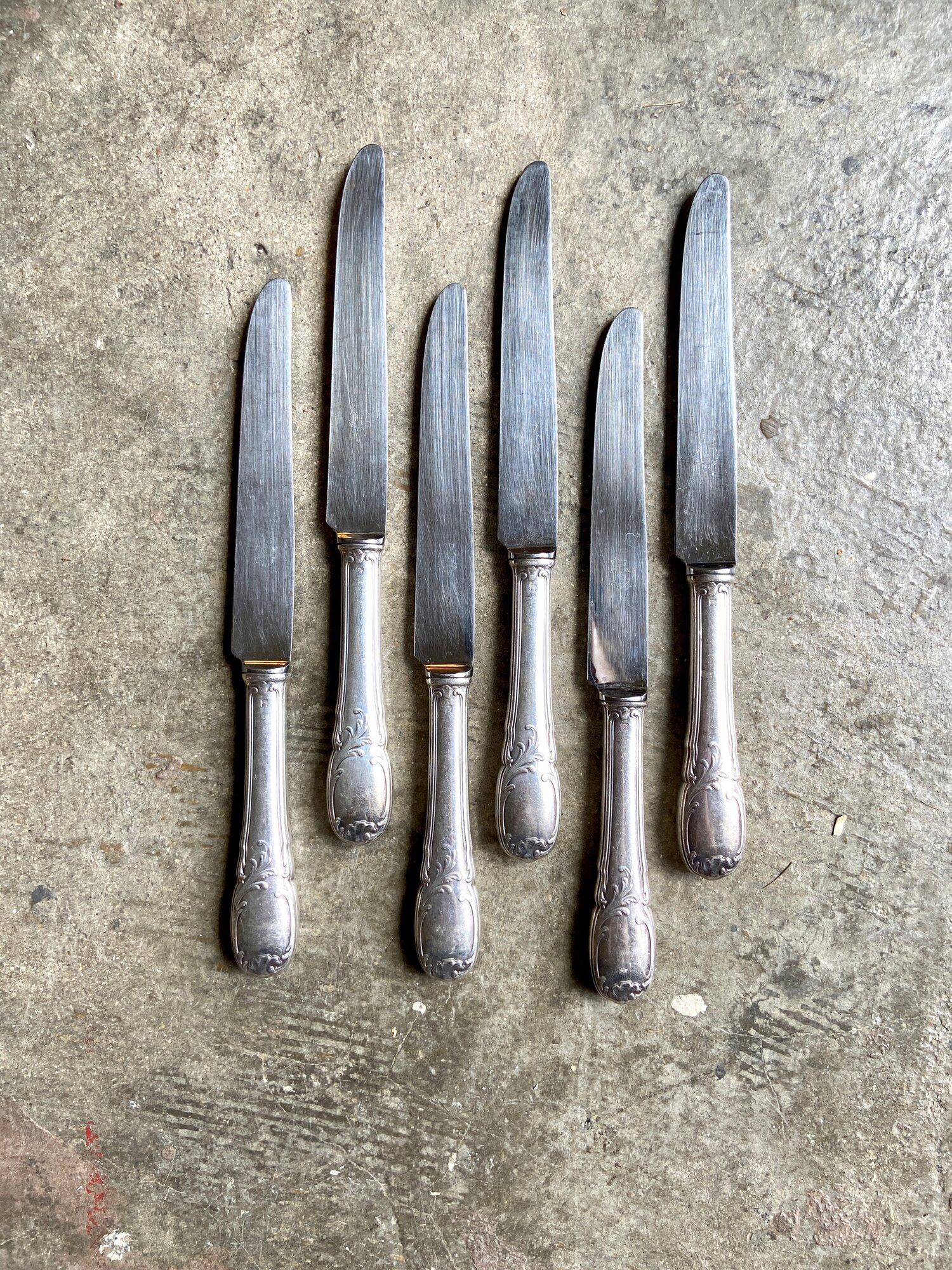 6 silver metal knives