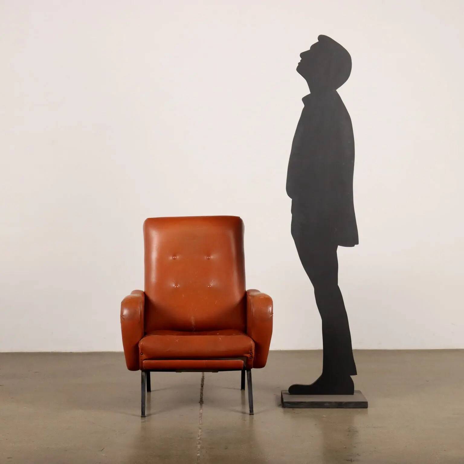 Vintage armchair from the 1970s in foam, faux leather, and metal.