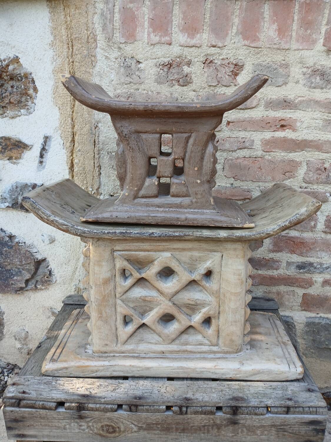 2 African carved wooden stools
