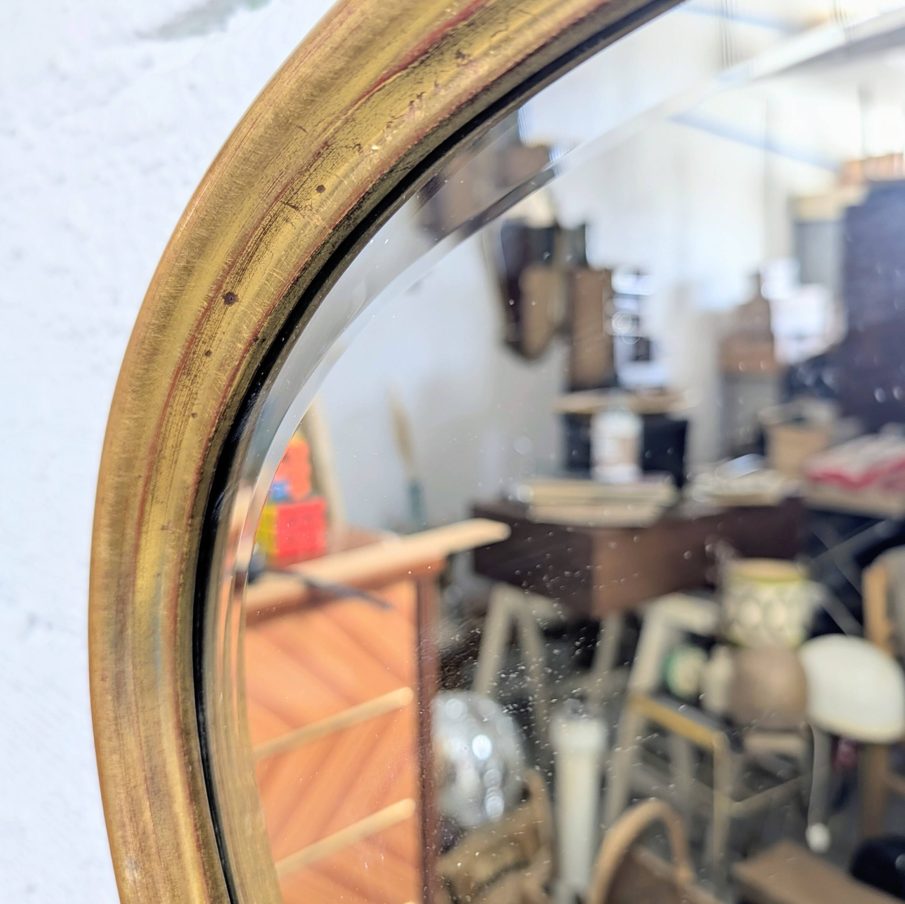 Louis-Philippe gilded mirror with shell pediment