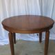 1930s oak dining table, slightly oval.