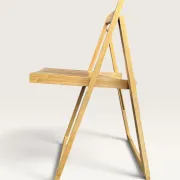 Blonde wooden folding chair in the style of Aldo Jacober.