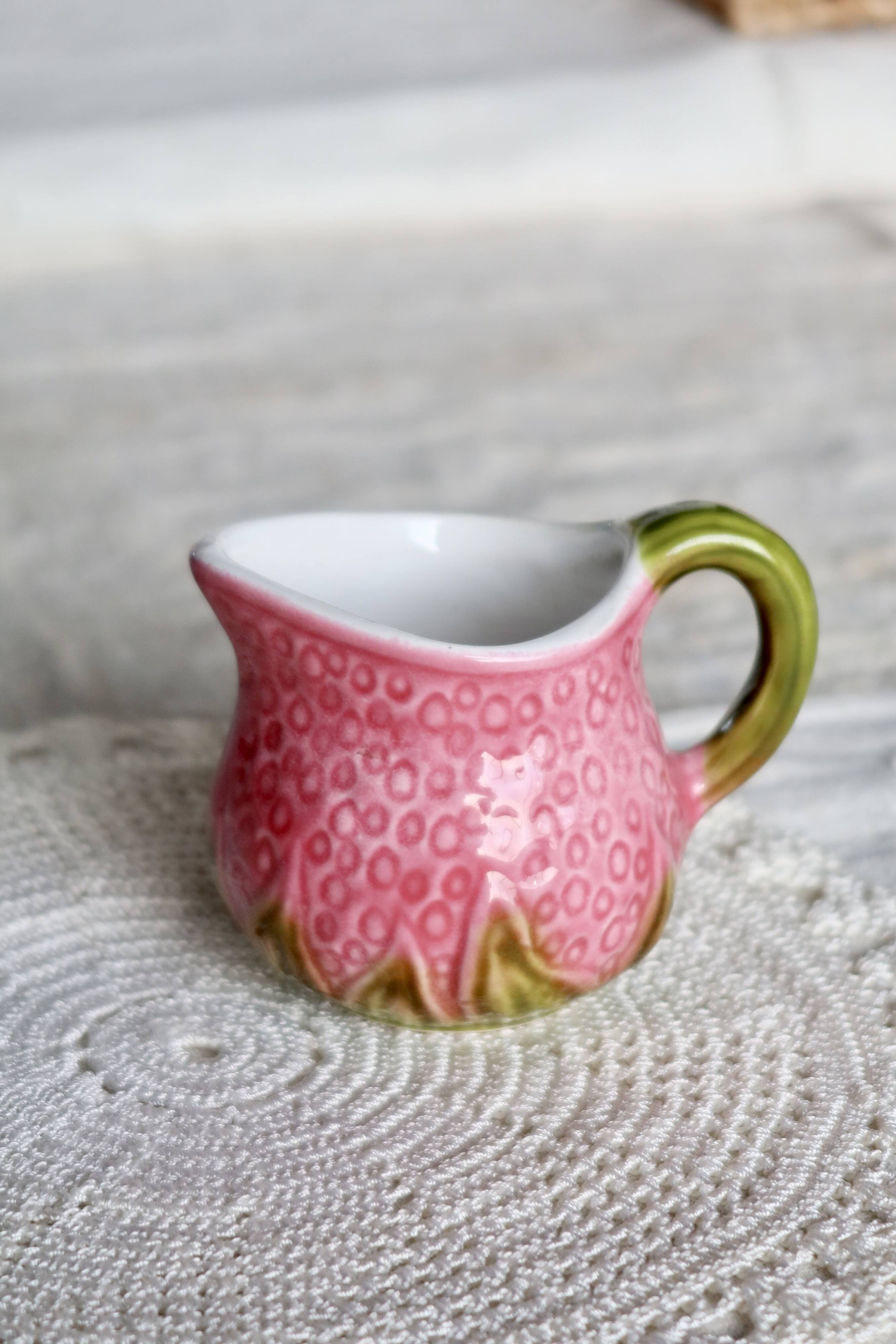 Vintage milk jug in Italian faience majolica.