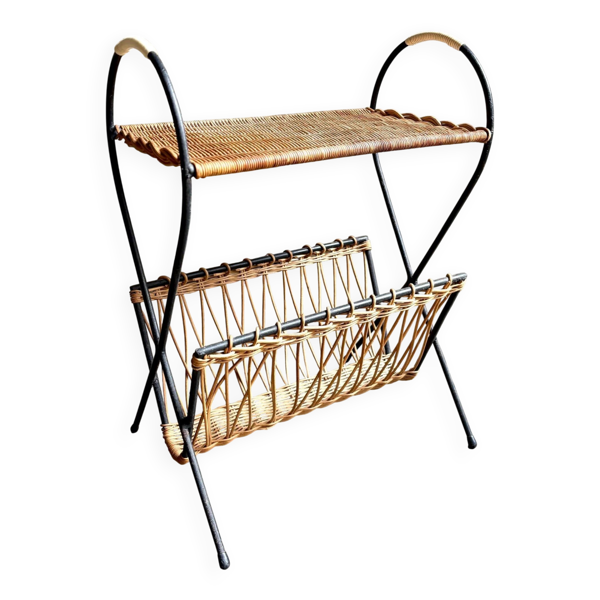 Black metal and woven wicker magazine rack