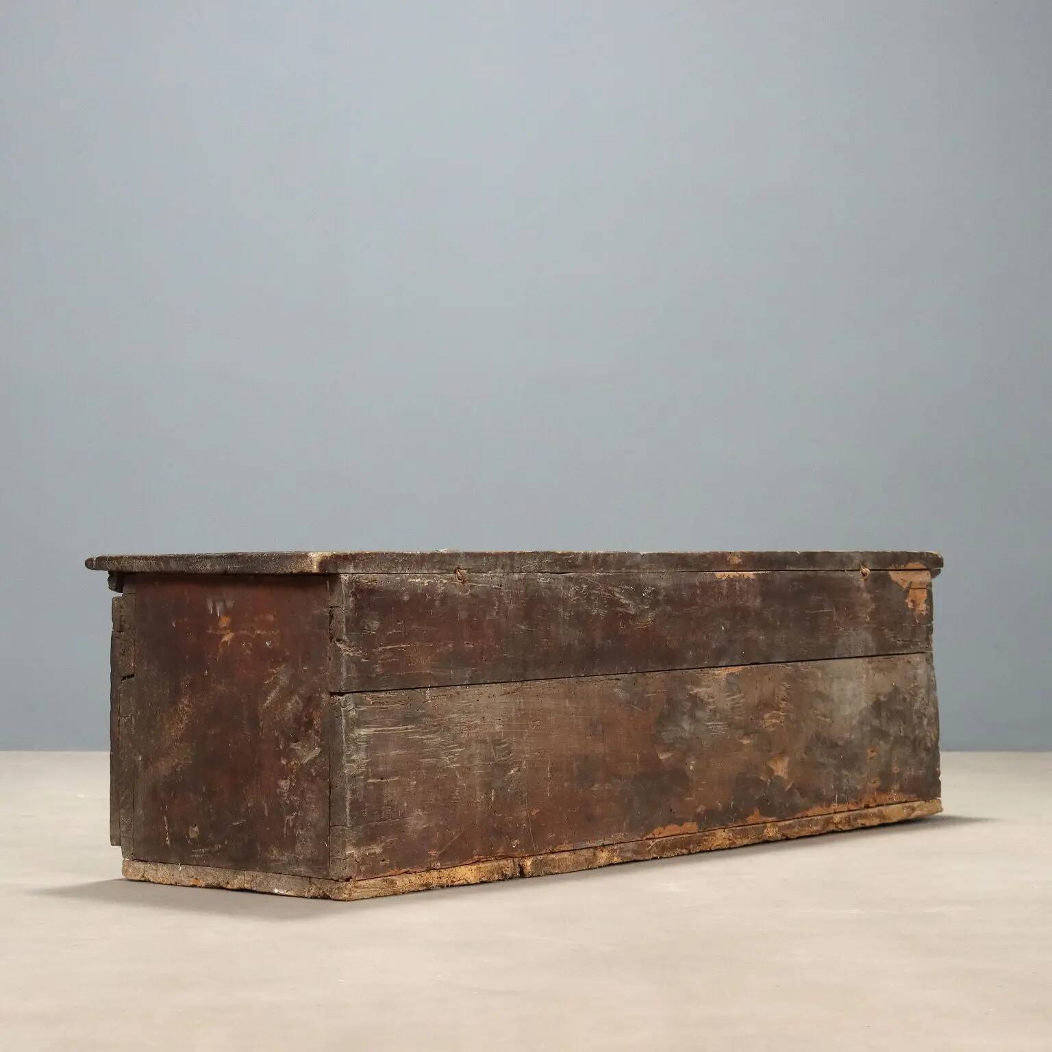 Antique walnut chest with a hinged lid, Italy, 17th century.