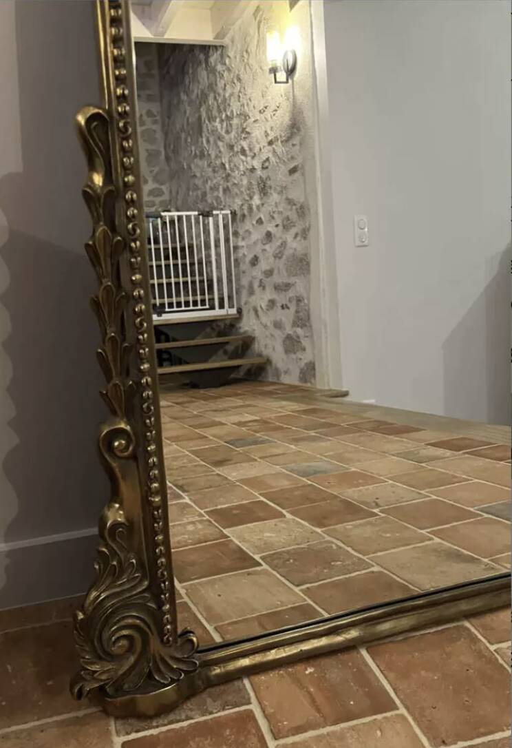 Large gilded mirror with pediment