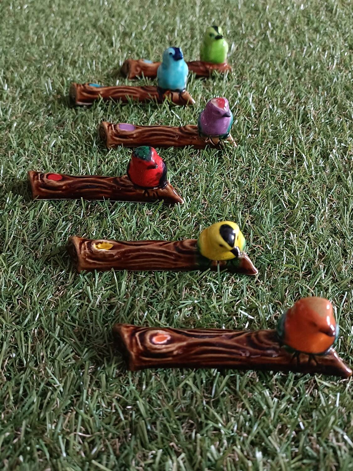 Set of six barbotine bird knife rests