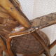 Old chair in braided chestnut