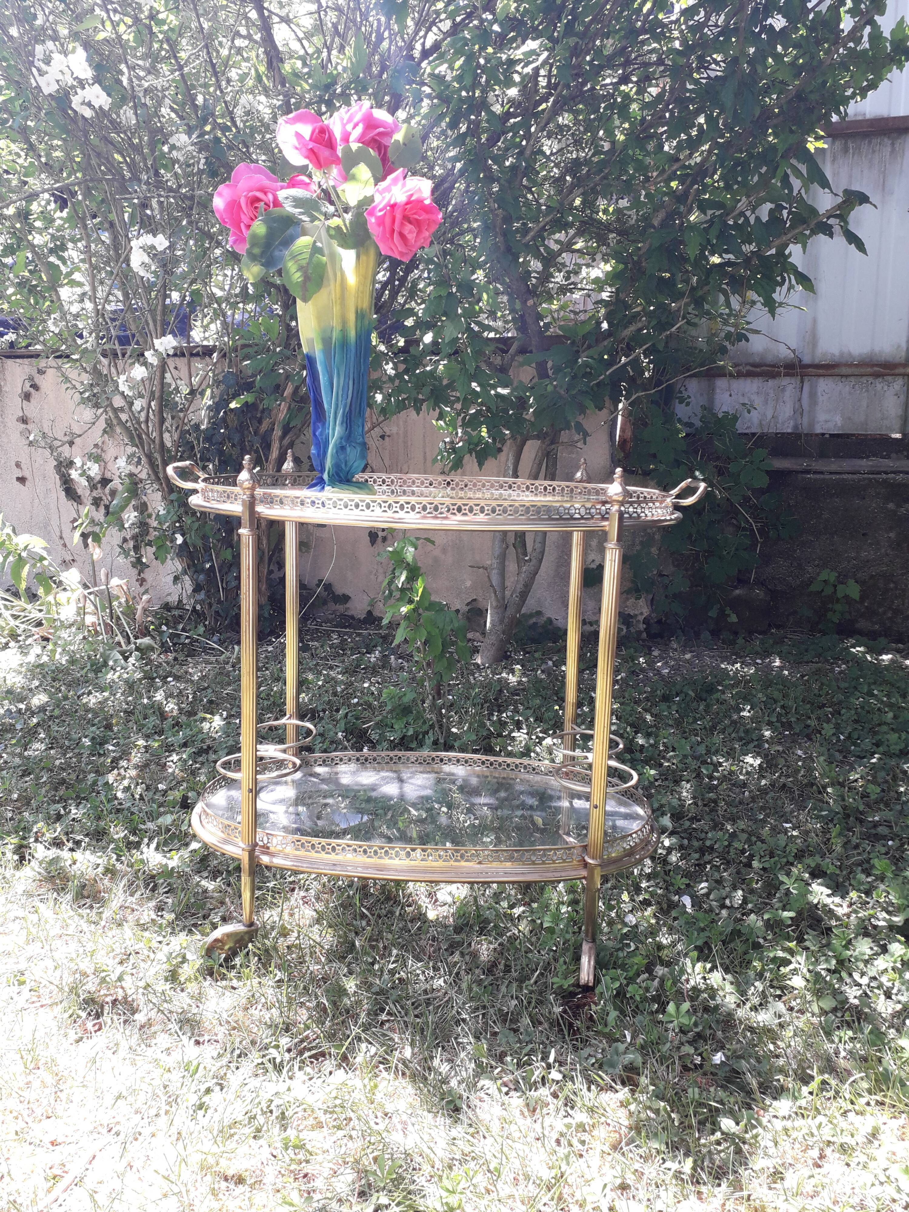 Dessert on brass wheels and glass door bottles year 60