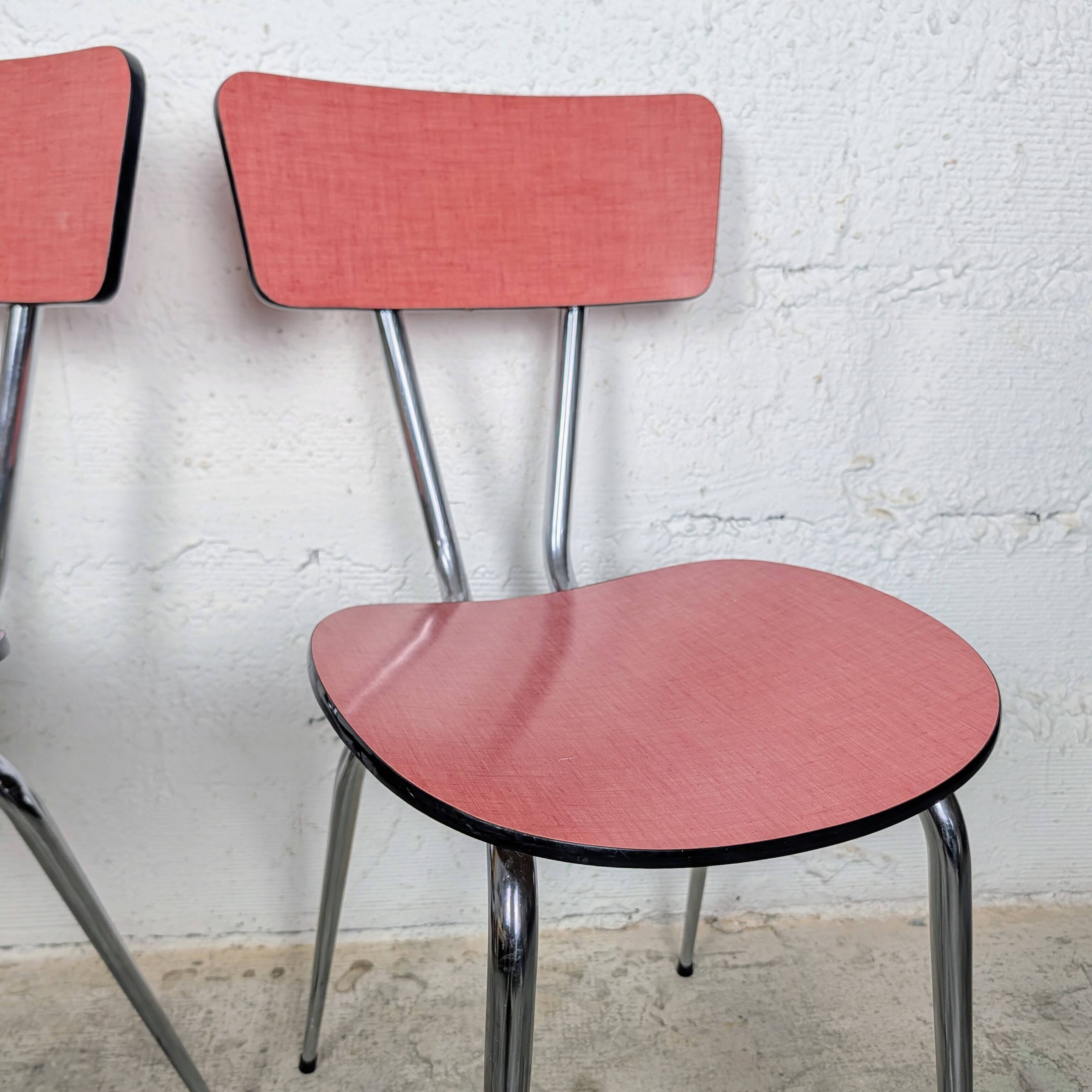 Pair of red Formica chairs with chrome legs