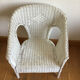 Vintage white rattan armchair