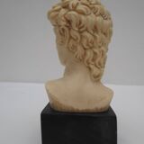 Small glass globe on base housing a figurine of “david”