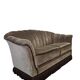 Vintage taupe two-seater canapé with fringes.