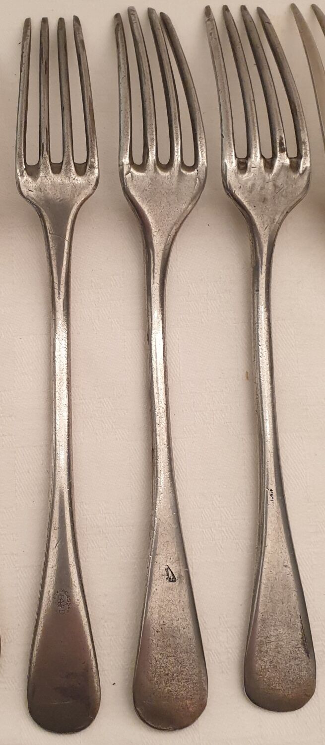 10 mismatched silver metal forks