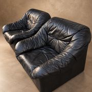Leather armchairs and matching pouf, Italy, circa 1980
