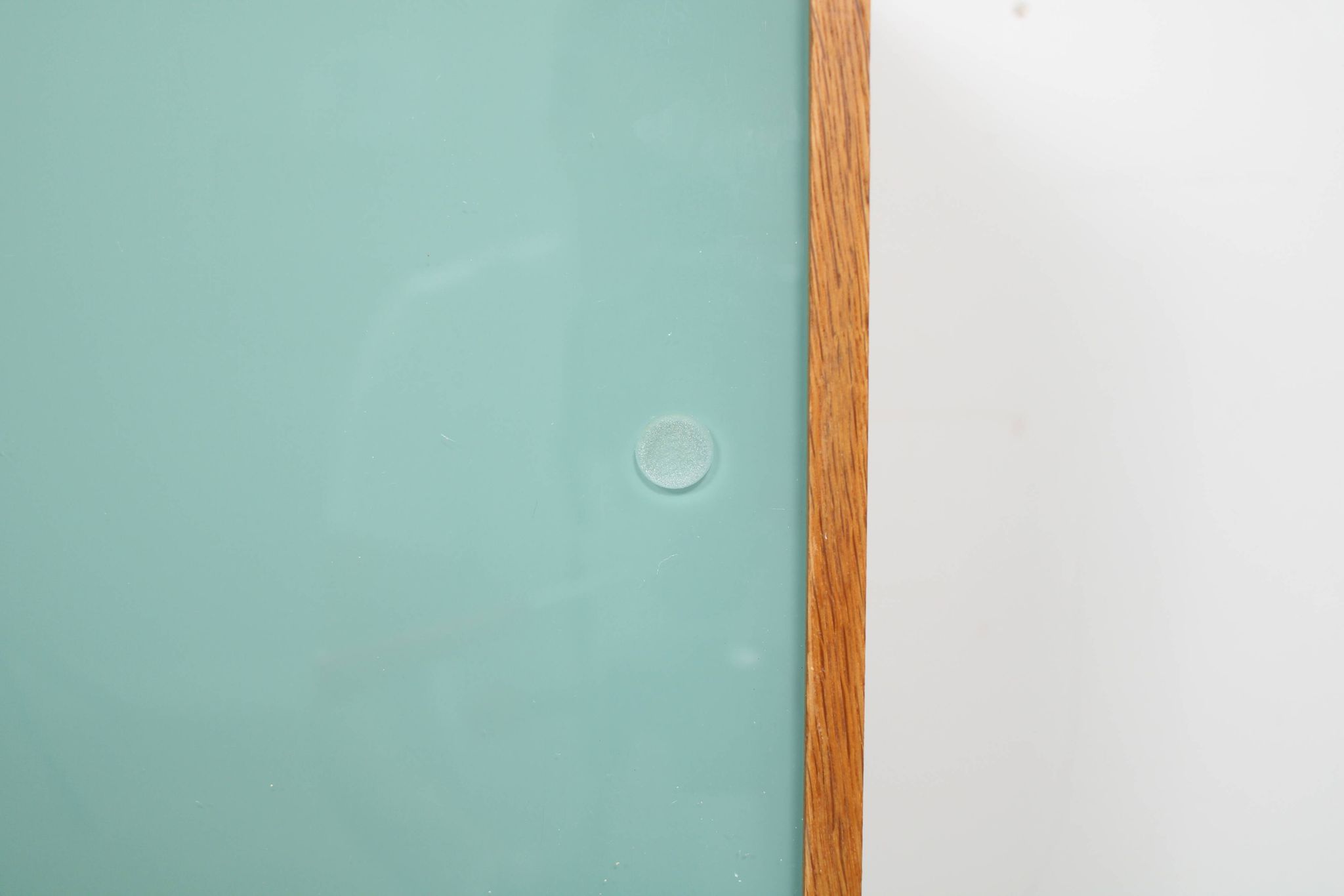 A vintage mid century wall hung bookcase/cabinet with glass sliding doors