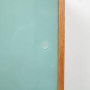 A vintage mid century wall hung bookcase/cabinet with glass sliding doors