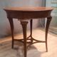 Round pedestal table in veneer wood