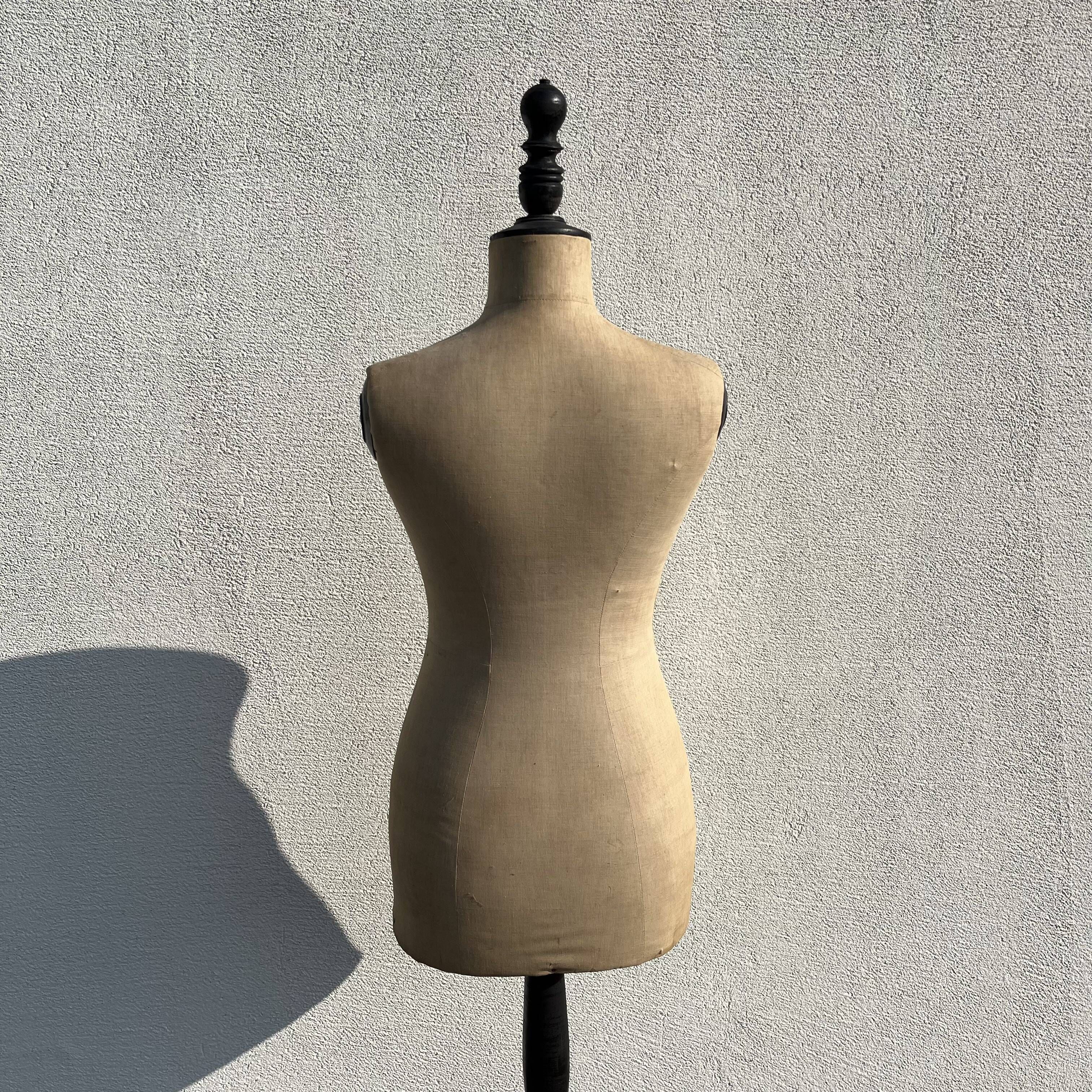 Antique mannequin in fabric and blackened wooden foot Stockman Paris Le Louvre