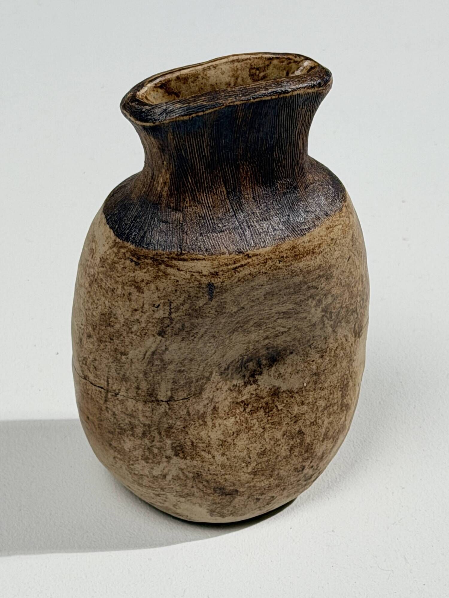 Small brutalist stoneware vase with a ribbed neck, France, circa 1960.