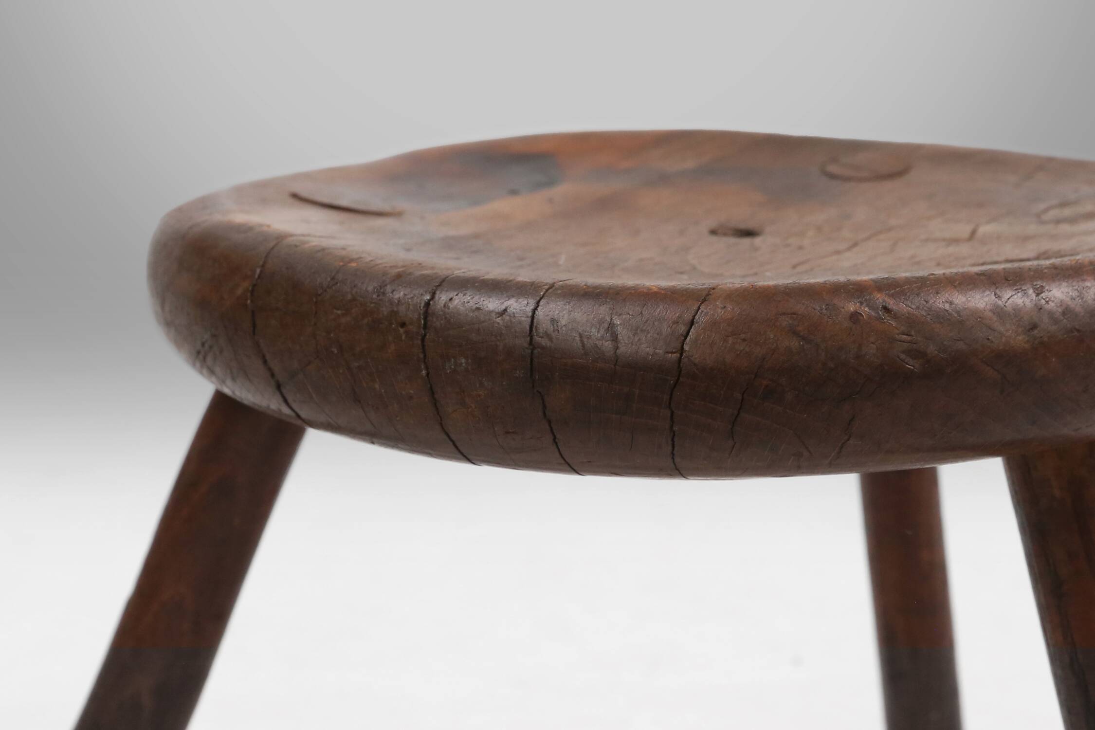 Hand-carved solid wood tripod stool with beautiful patina, France ca. 1900