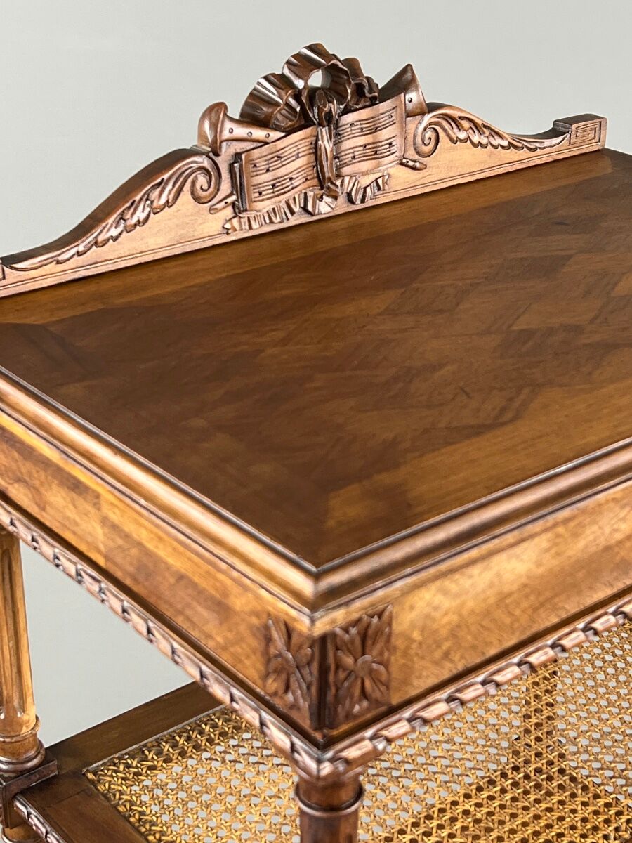 Louis XVI style music cabinet in carved wood with caning, 19th century.